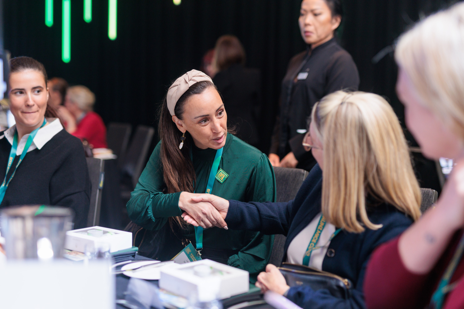 Event professionals connecting around a table at AUNZ MICE Club Sydney